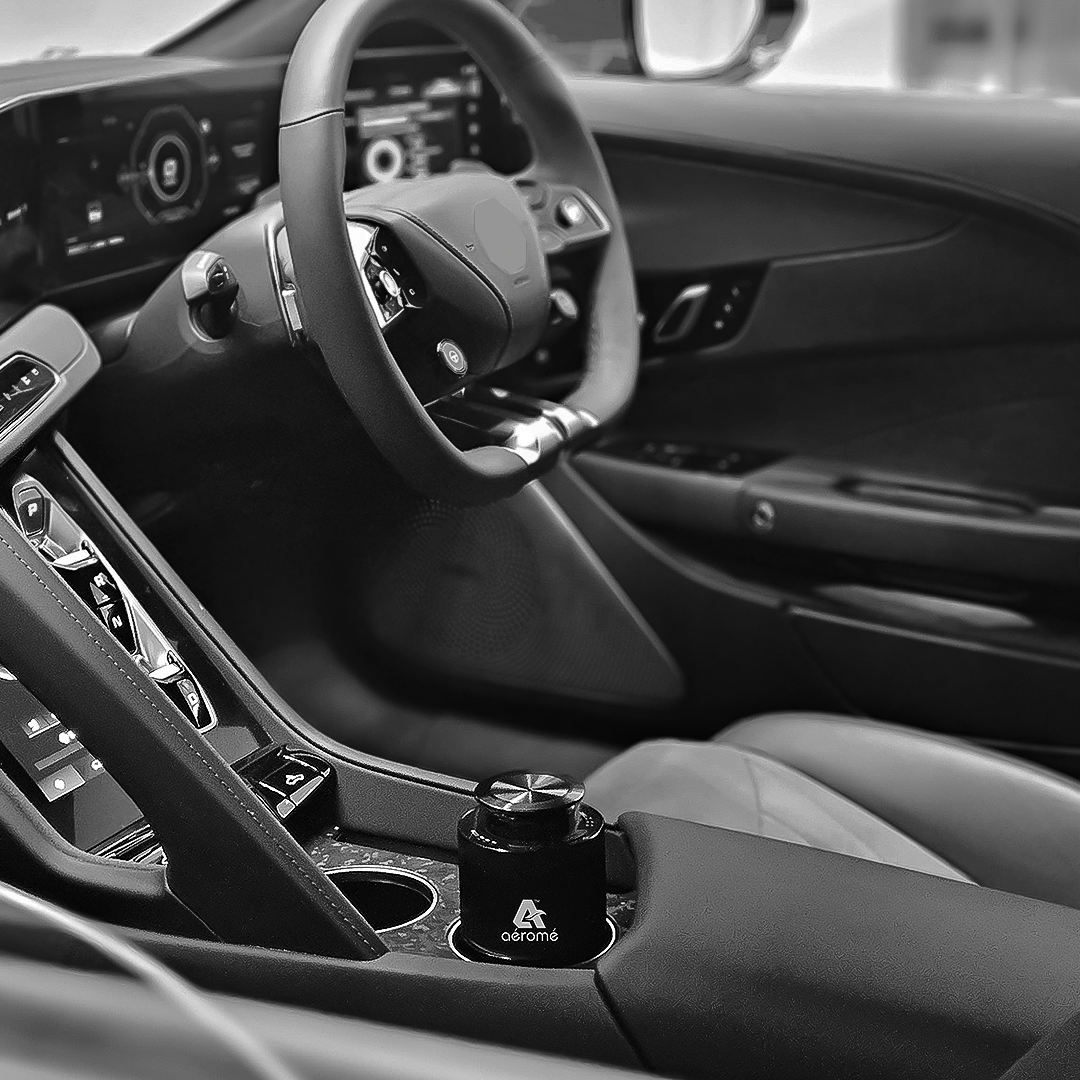 Scent Cup car diffuser installed in luxury car cupholder